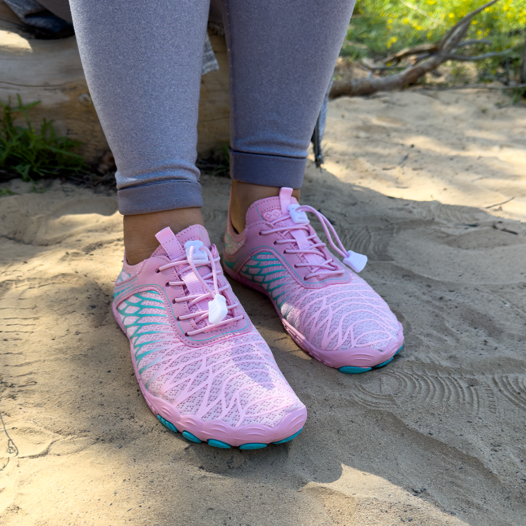The Wide-Toe Barefoot Walker in Pink, on sand