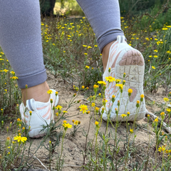 The Wide-Toe Barefoot Walker in White, outdoors
